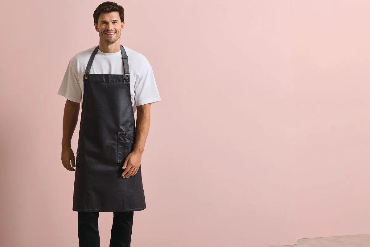 Premier District halterschort in gewaxte denimlook – te bedrukken met jouw logo of tekst